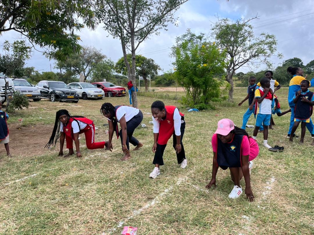 Parents supporting their children during sports day