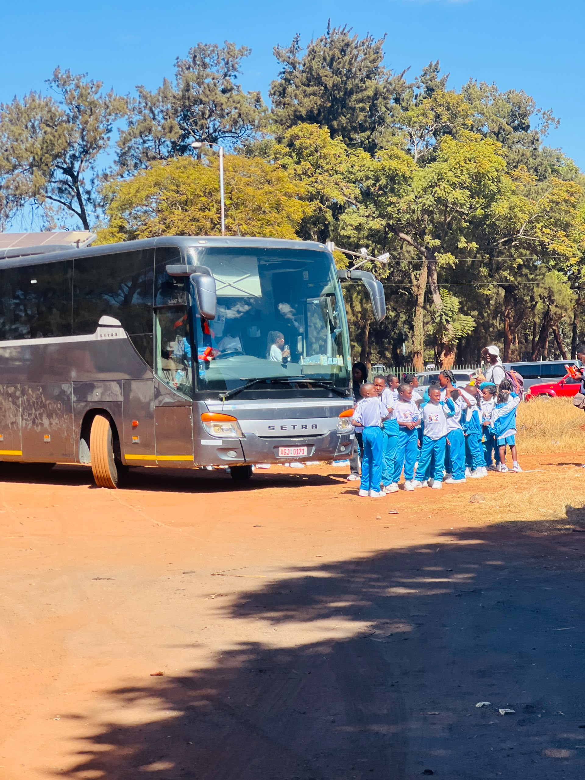 Jewels Junior School learners boarding a bus for a trip